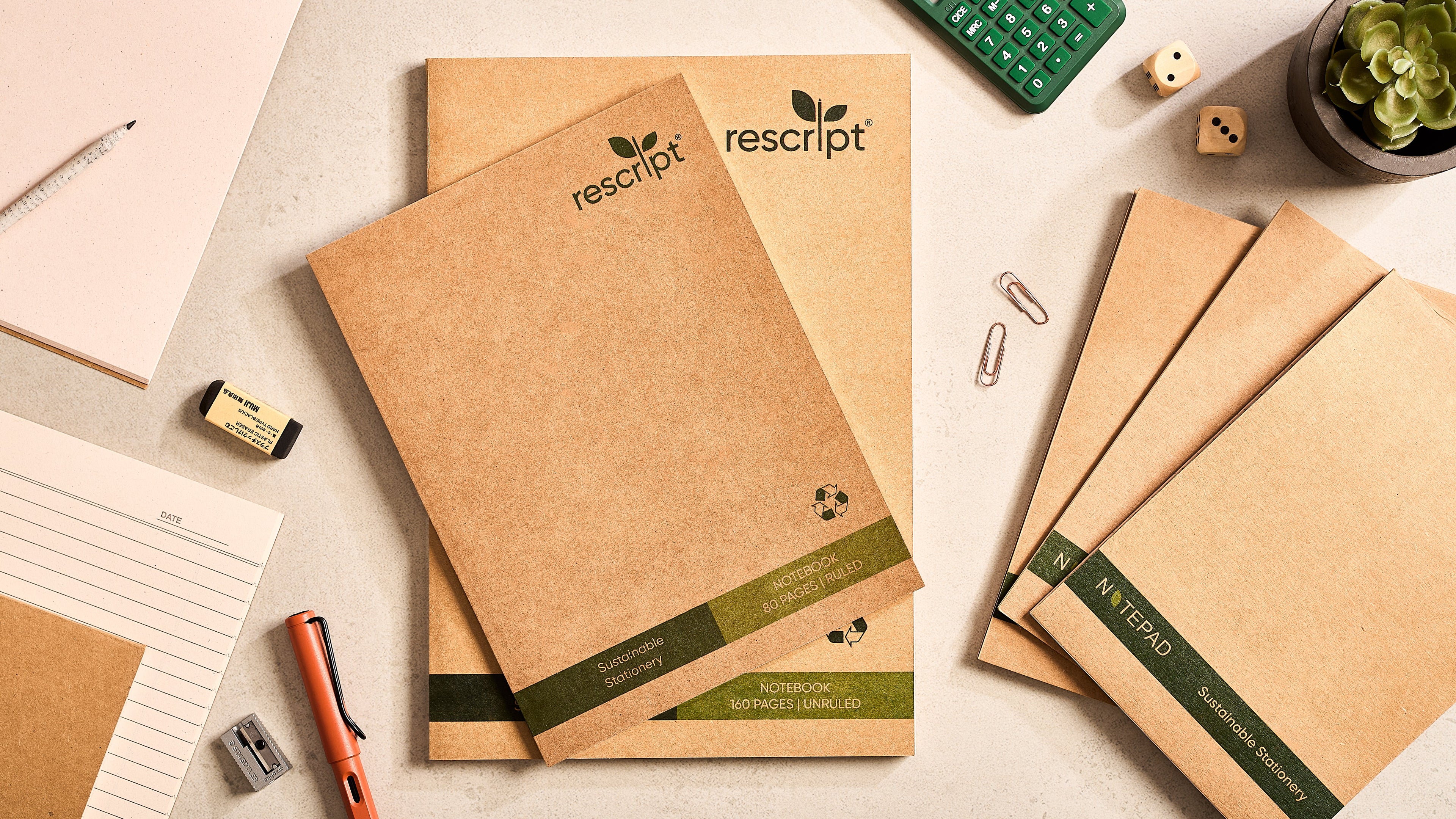 Stack of six eco-friendly recycled paper notebooks