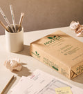 Box of rescript recycled A5 paper on a desk