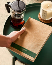 Eco-friendly A5 journal with recycled paper and a green spine